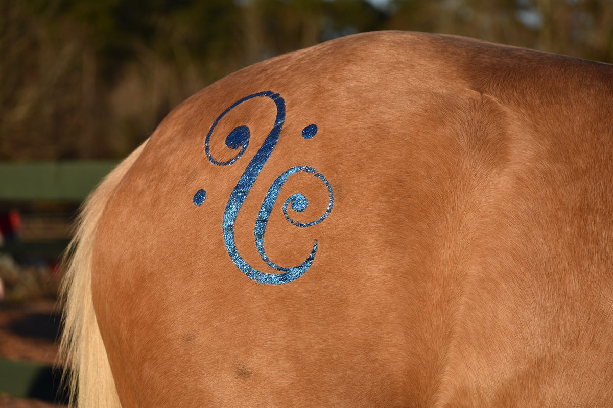 Blue glitter swirl design, close up